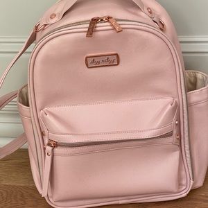 Itzy Ritzy Mini - Pink Blush and rose gold hardware w changing pad. Used twice.